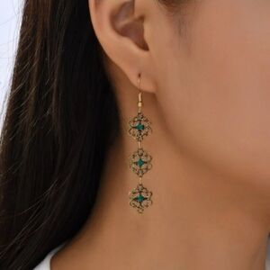 Stunning dangle earrings with green accents